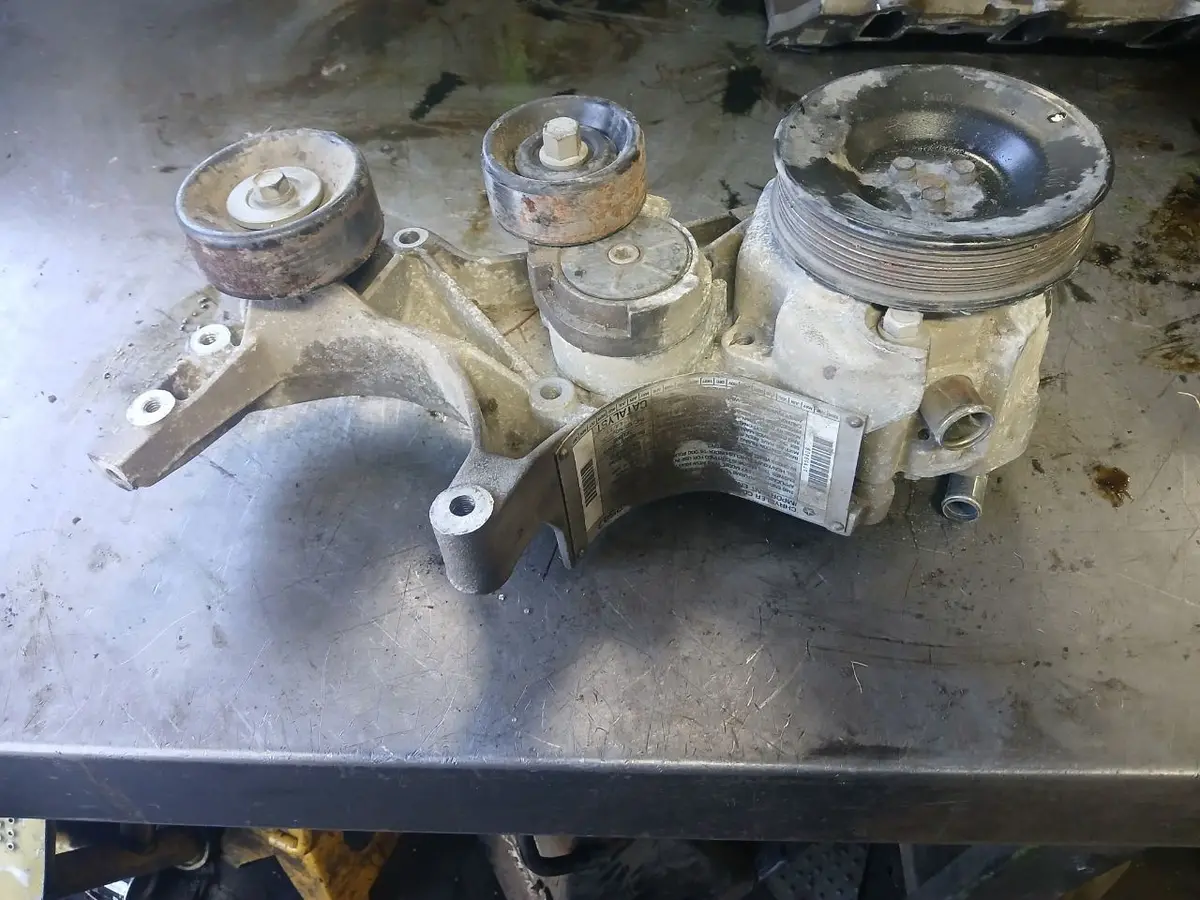 1997 Ram 2500 8.0L V10 Air Pump And Tensioner Bracket. Part Number 53005621Ab 1